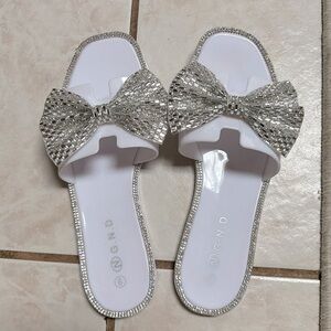 GND white flip flops with silver bows size 9